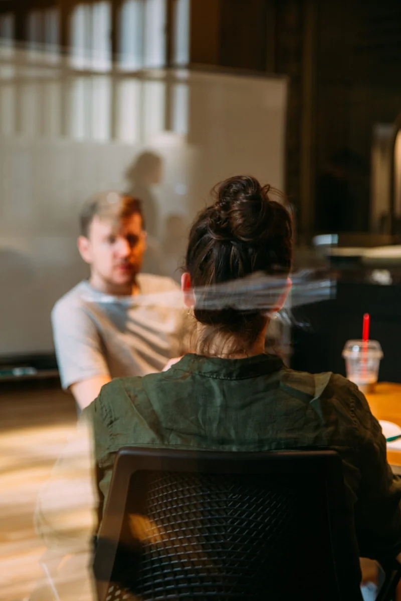 Two people speaking in a one-to-one mentoring session