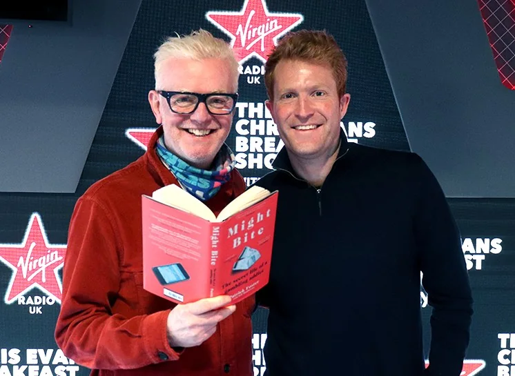 Patrick Foster with Virgin Radio DJ Chris Evans holding a copy of his book